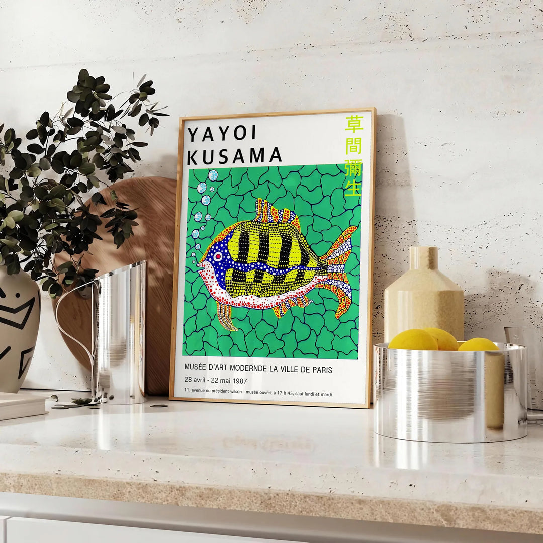 Colorful polka dots on a black background in Yayoi Kusama's signature style - styled on a counter with eucalyptus and a bowl of lemons