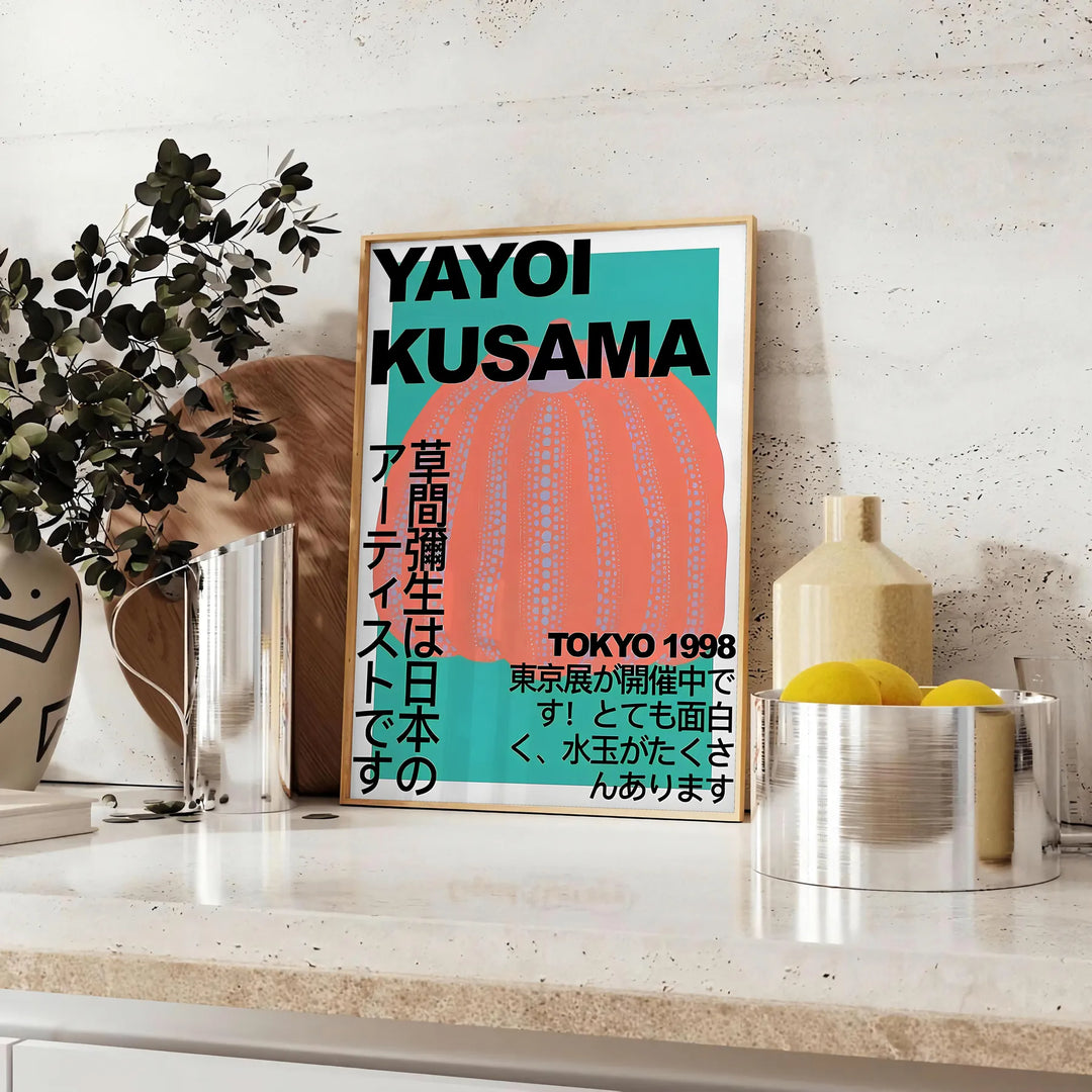 Abstract polka dot pattern in blue and brown by Yayoi Kusama - styled on a counter with eucalyptus and a bowl of lemons
