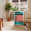 Abstract polka dot pattern in blue and brown by Yayoi Kusama - in a Parisian living room with a sofa and a fig plant