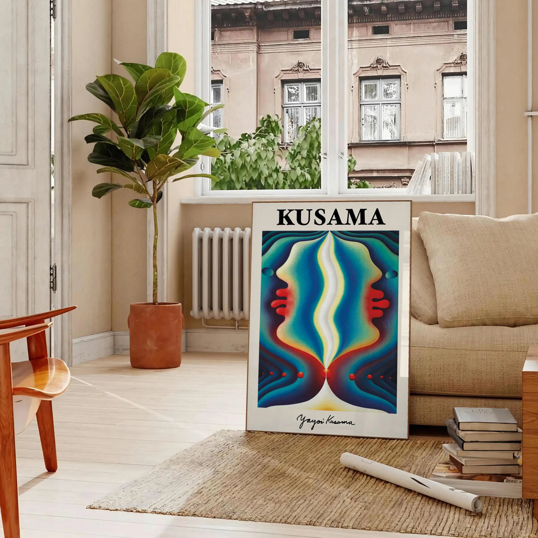 Colorful polka dots in orange and green by Yayoi Kusama - in a Parisian living room with a sofa and a fig plant