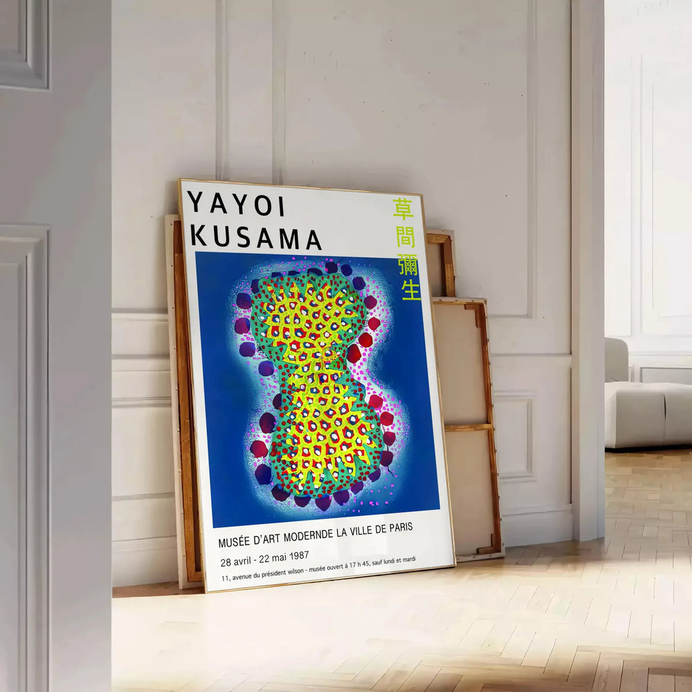 Colorful polka dots in various sizes on a deep blue background by Yayoi Kusama