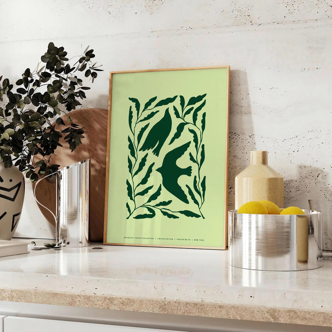 Abstract representation of yoga poses in green and gray hues - styled on a counter with eucalyptus and a bowl of lemons