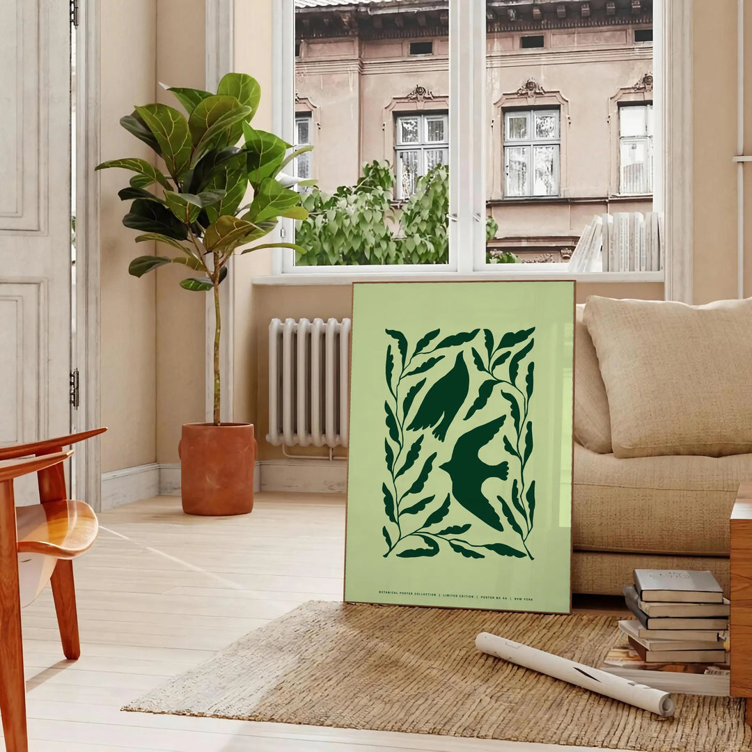 Abstract representation of yoga poses in green and gray hues - in a Parisian living room with a sofa and a fig plant