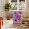 A serene yoga figure in a meditative pose against a gradient of blue and purple hues - in a Parisian living room with a sofa and a fig plant