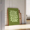 Serene yoga scene with green tones and abstract shapes - leaning on a herringbone floor against a white panelled wall