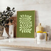 Serene yoga scene with green tones and abstract shapes - styled on a counter with eucalyptus and a bowl of lemons