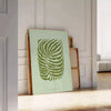 A serene yoga scene with calming green and gray tones - leaning on a herringbone floor against a white panelled wall
