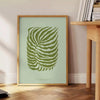 A serene yoga scene with calming green and gray tones - beside a round wooden side table with books