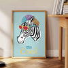 Black and white zebra stripes on a textured background - beside a round wooden side table with books