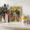 Vintage poster depicting cyclists racing through a green landscape with orange accents