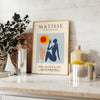 Poster of Matisse woman papiers découpés artwork in white and orange.
