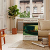 Edward Hopper exhibition poster featuring a realist urban scene with muted gray and orange tones