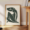 Matisse-style blue cutout figure on a white-gray background