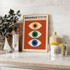 Bauhaus poster featuring stylized eyes in bold orange and green