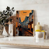 Montmartre poster with stylized illustration of Paris in green and orange