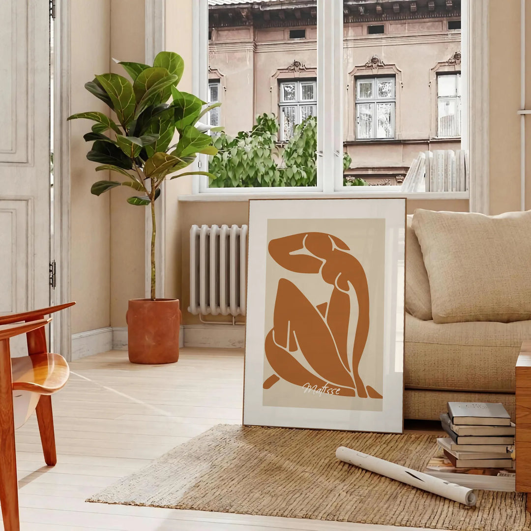 Matisse's Blue Nude II featuring cutout shapes in blue, white, and brown