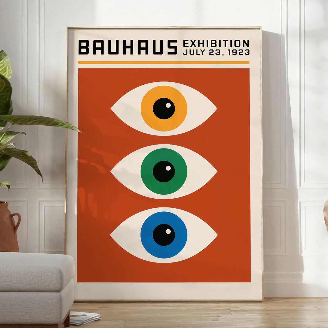 Bauhaus poster featuring stylized eyes in bold orange and green
