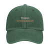 Embroidered cap featuring a vintage tennis design with Normandie text