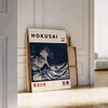 Hokusai's iconic wave in shades of black and gray with green accents