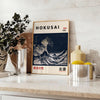 Hokusai's iconic wave in shades of black and gray with green accents