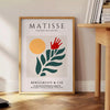 Matisse's paper cut-out artwork featuring abstract shapes in white and green