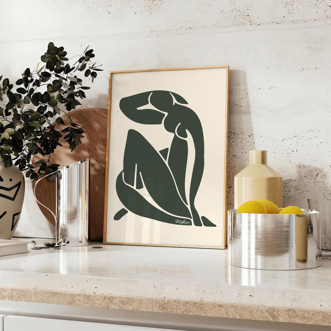 Matisse-style blue cutout figure on a white-gray background