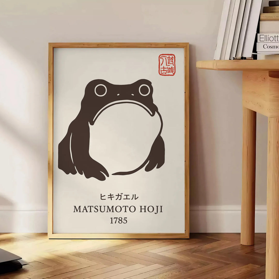 Japanese poster featuring a frog surrounded by blue waves and earthy tones