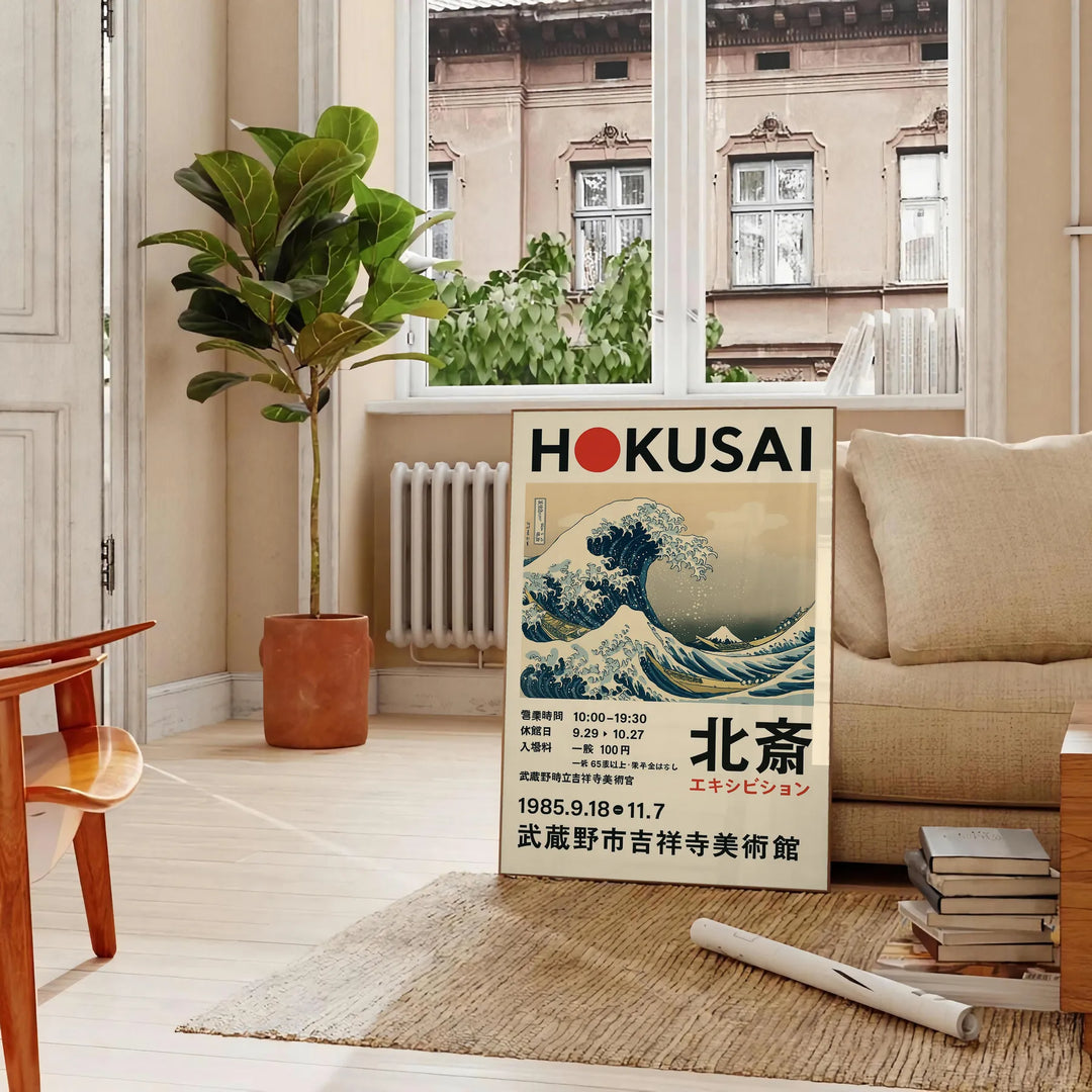 Hokusai exhibition poster featuring waves and red accents
