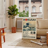Hokusai exhibition poster featuring waves and red accents