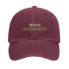 Embroidered cap featuring a vintage tennis design with Normandie text
