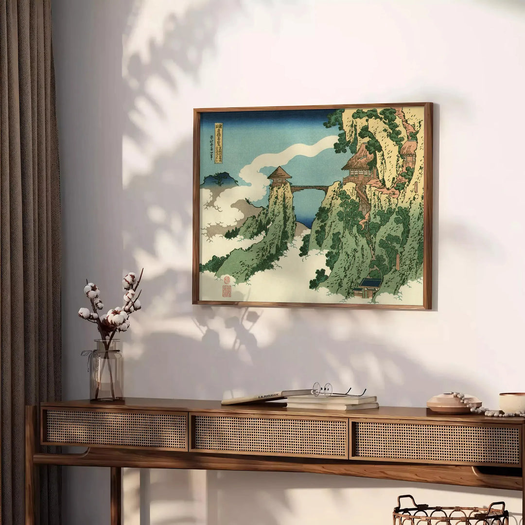 Woodblock-style landscape featuring a bridge shrouded in clouds
